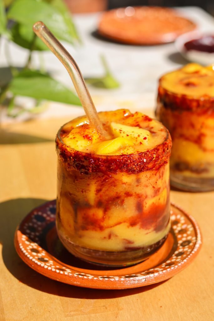 easy mangonada recipe in a mexican cup.
