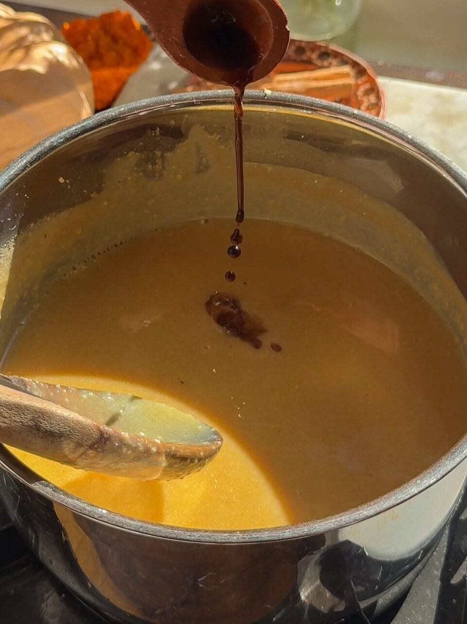Add vanilla to the pot of atole.