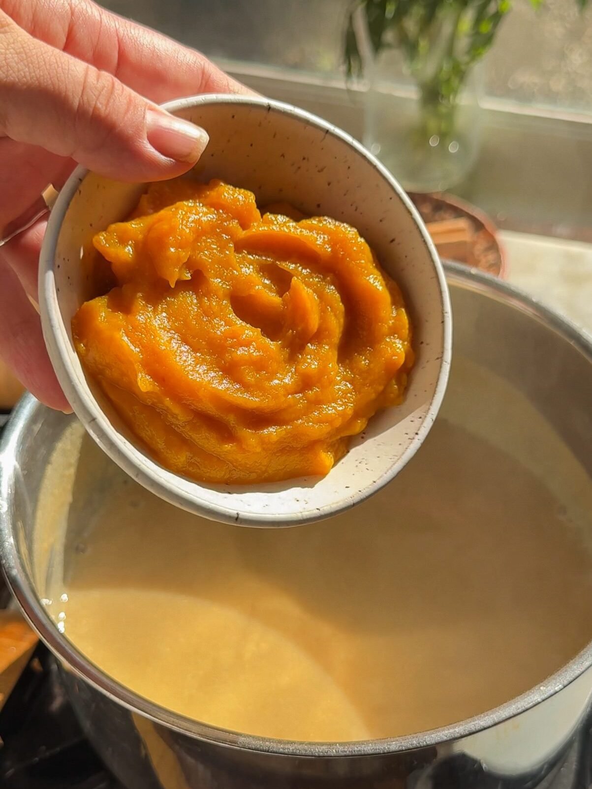 Add pumpkin to the atole pot.